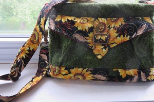 Seneca bag converts from shoulder bag to waist pouch.